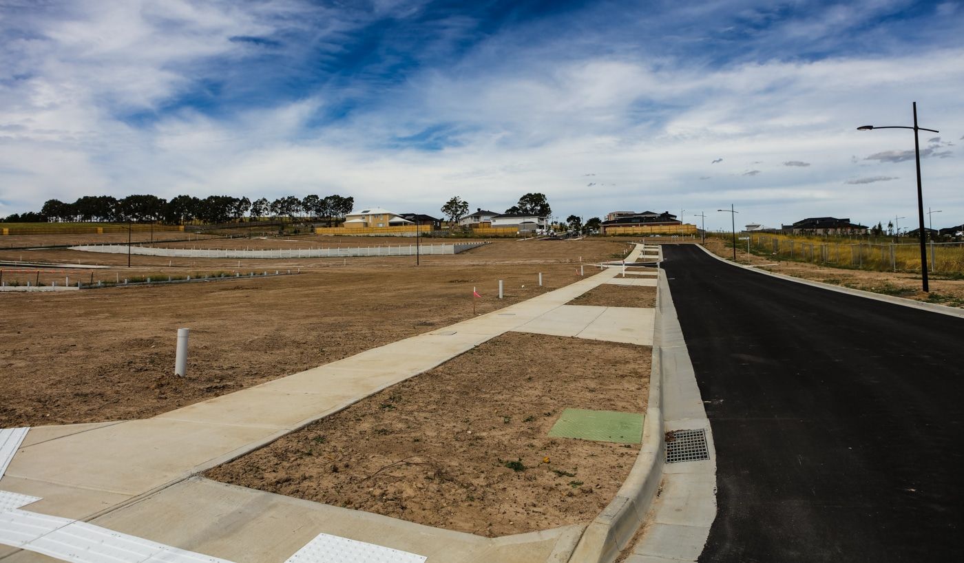 New subdivision street, curb, and sidewalk laid out from construction staking